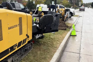 Directional drilling crew installing underground utilities using a Vermeer HDD rig as part of commercial site services in Peoria, IL. Directional Drilling in Champaign IL